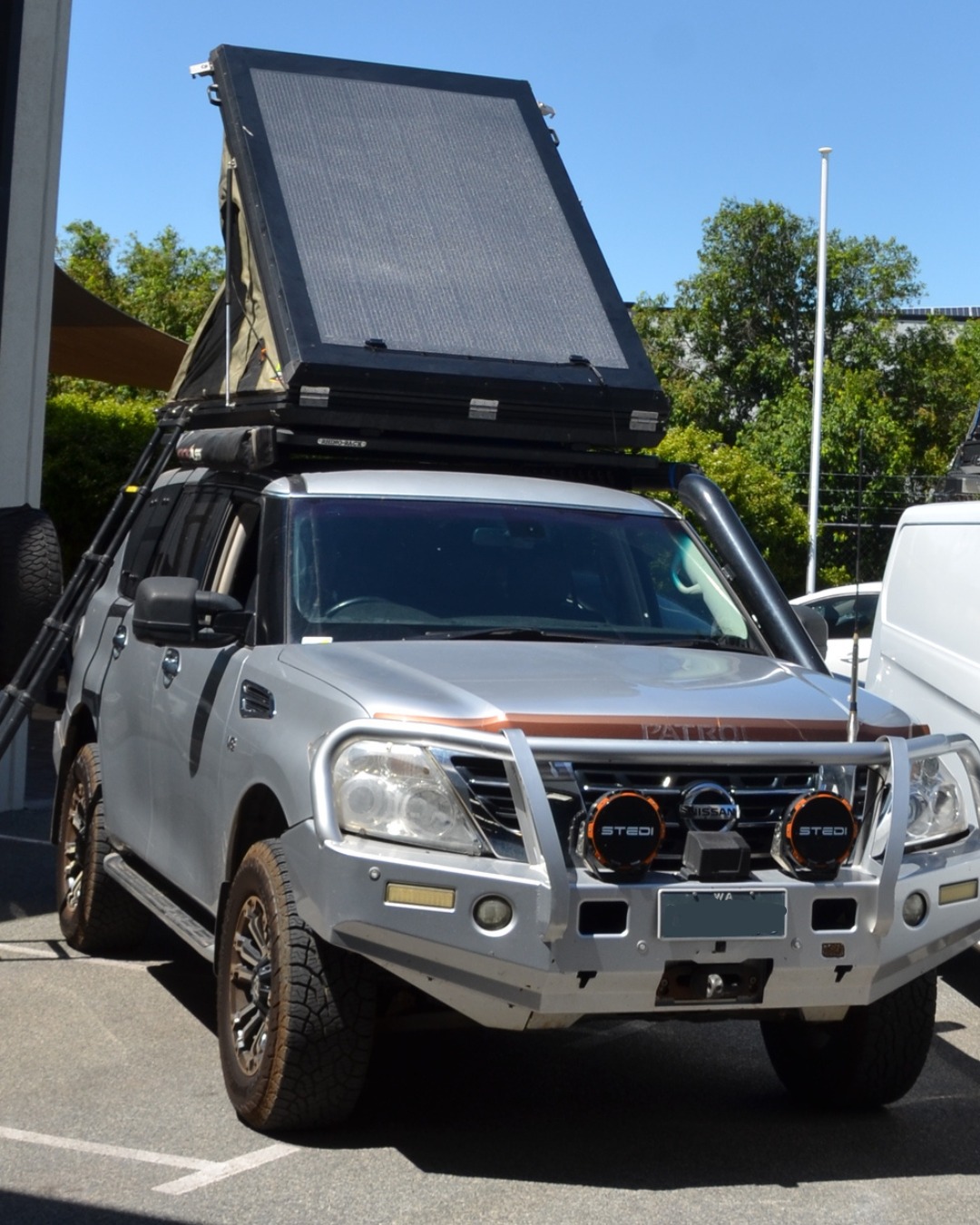 Custom hard shell rooftop tent with 400W flexible solar solution
